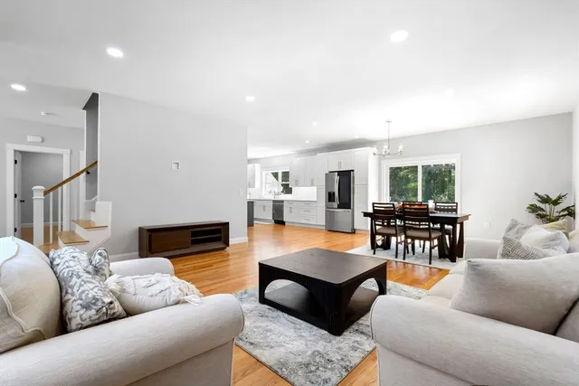 a living room with furniture and a table