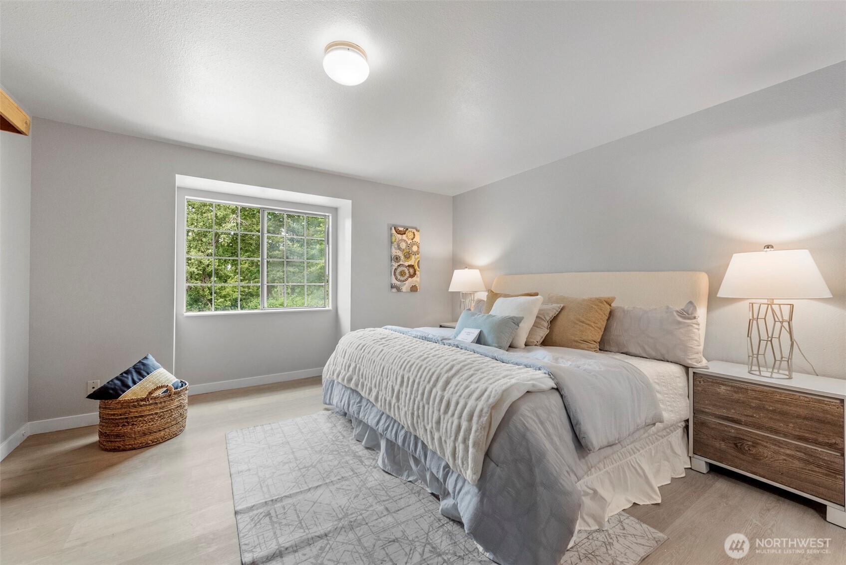 4302 155th Street Southwest Lynnwood, WA 98087 - Photo 11 of 19 a spacious bedroom with a bed and a window