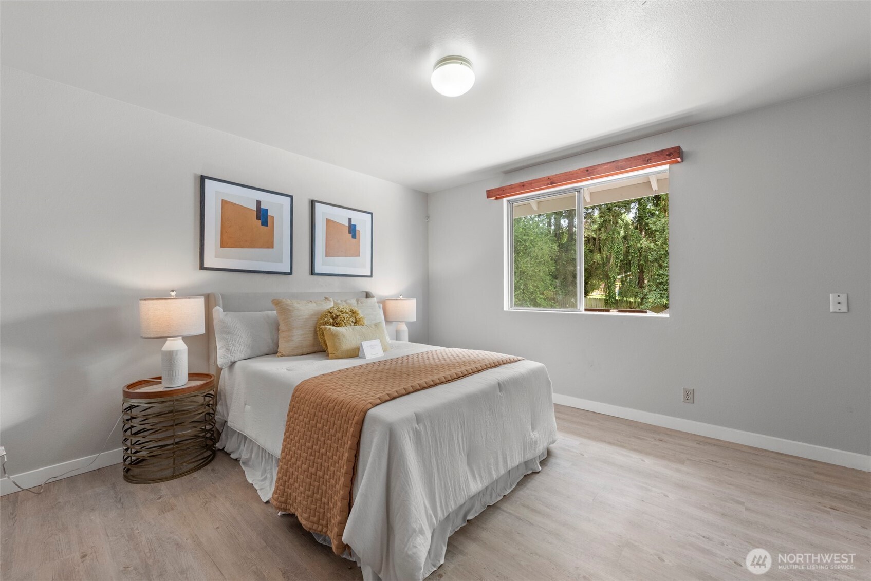 4302 155th Street Southwest Lynnwood, WA 98087 - Photo 14 of 19 a bedroom with a bed and a window