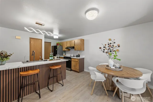a view of a dining room with furniture window and wooden floor