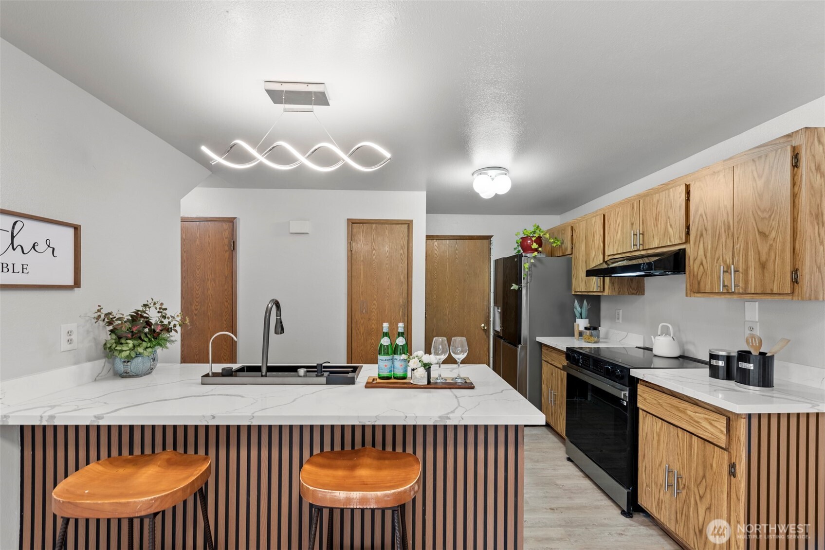 4302 155th Street Southwest Lynnwood, WA 98087 - Photo 9 of 19 a kitchen with a table and chairs in it