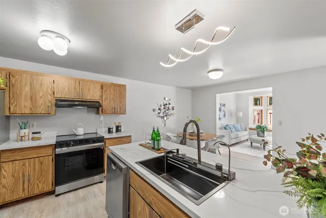 a kitchen with a stove and a sink