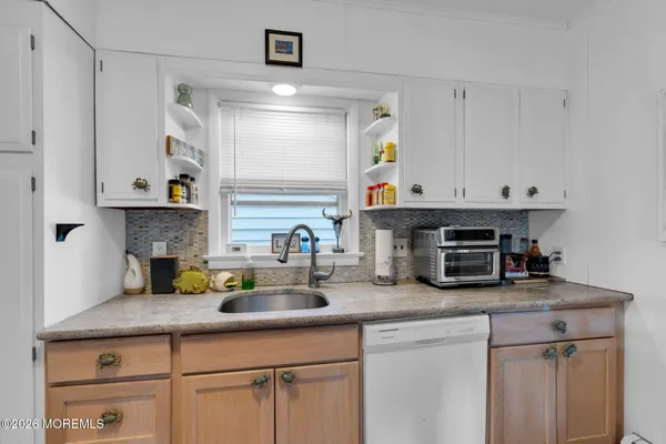 a kitchen with appliances a cabinets and a counter space