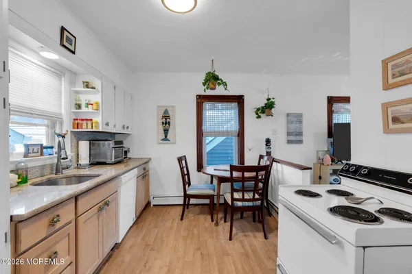 a kitchen with a dining table and chairs
