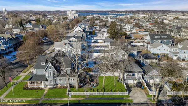 an aerial view of a house with a yard