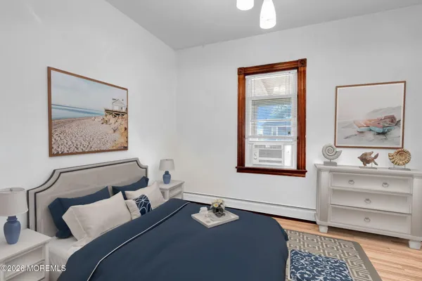 a bedroom with bed and window