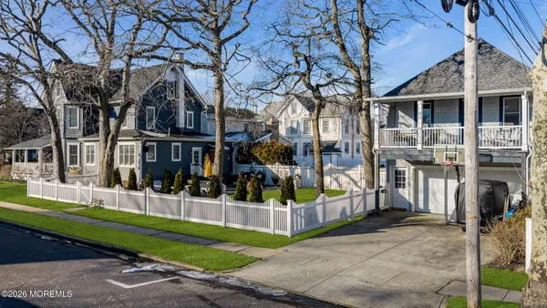 a view of a building with a backyard