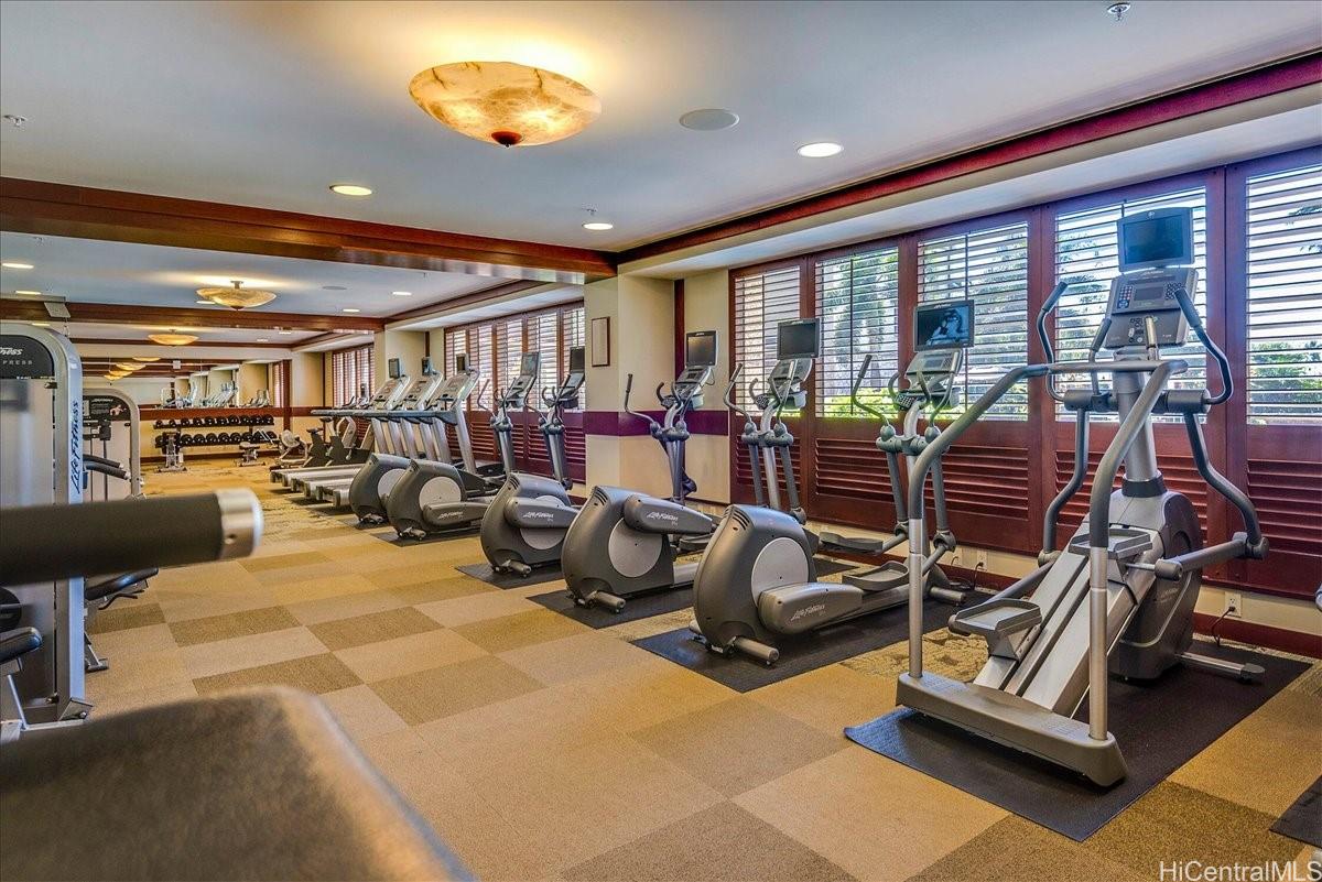 92-104 Waialii Place, Unit O422 Kapolei, HI 96707 - Photo 16 of 25 a room with gym equipment and a large window