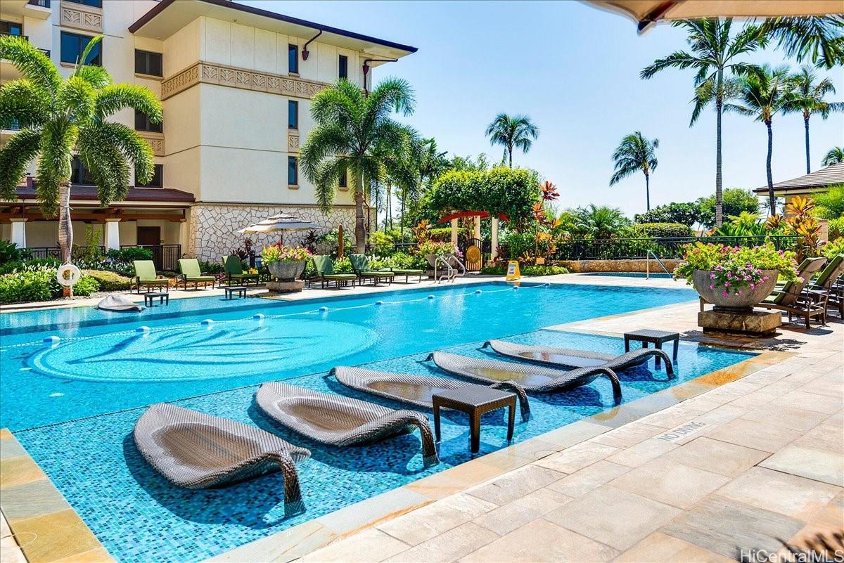 92-104 Waialii Place, Unit O422 Kapolei, HI 96707 - Photo 19 of 25 a view of swimming pool with outdoor seating