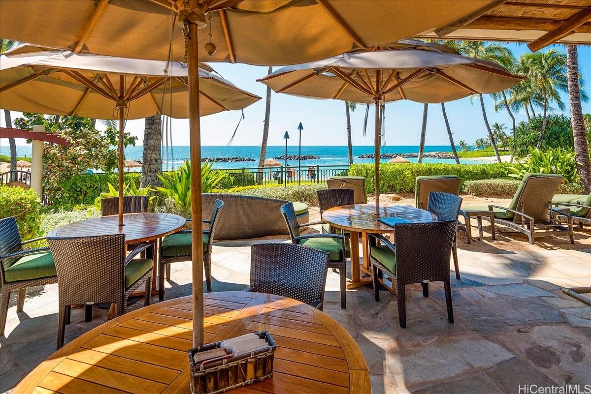 92-104 Waialii Place, Unit O422 Kapolei, HI 96707 - Photo 22 of 25 a view of chairs and table in the patio