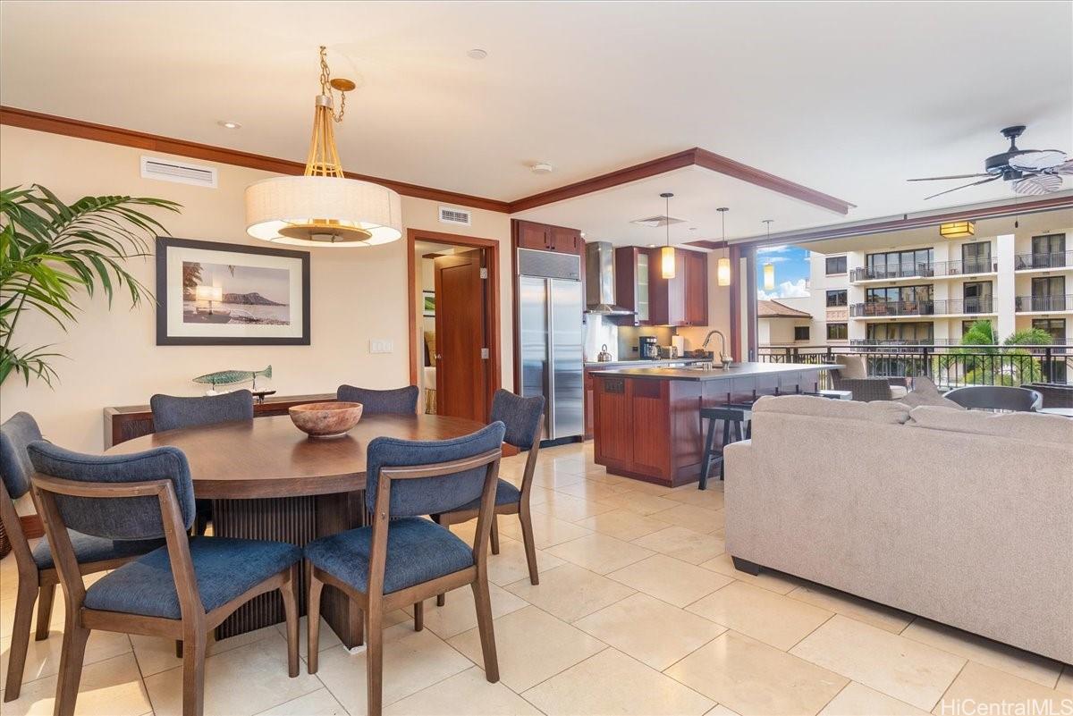 92-104 Waialii Place, Unit O422 Kapolei, HI 96707 - Photo 3 of 25 a view of a dining room with furniture and a chandelier