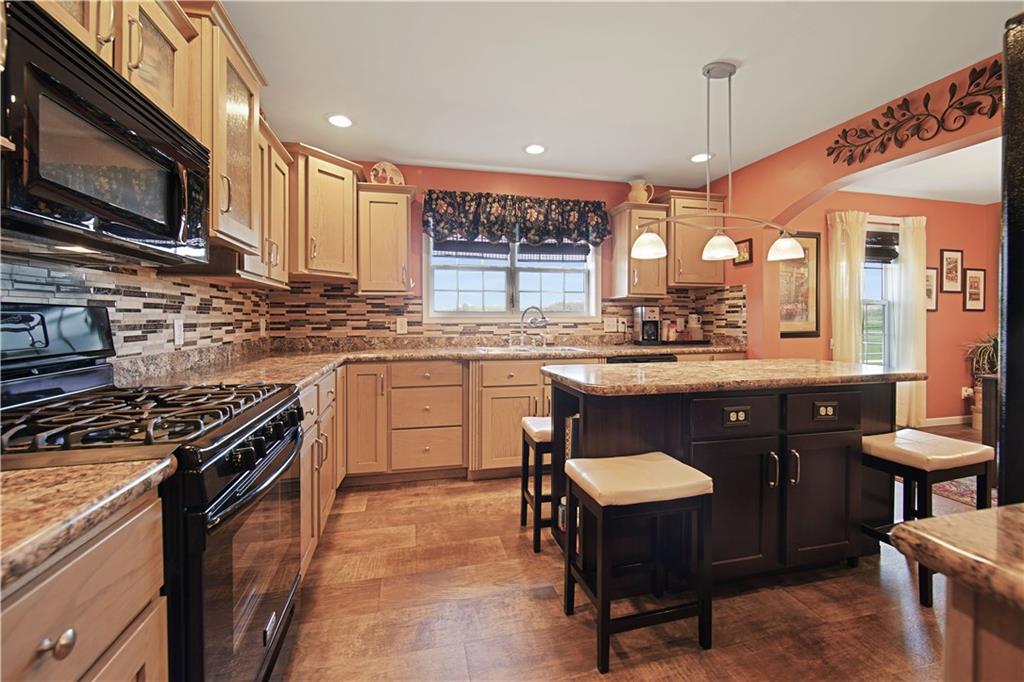 195 Elm Road Avella, PA 15312 - Photo 11 of 25 This view of the kitchen lets you see more of the strong congoleum flooring and propane gas stove. The attractive overhead into the dining room adds glamour to an already attractive room.