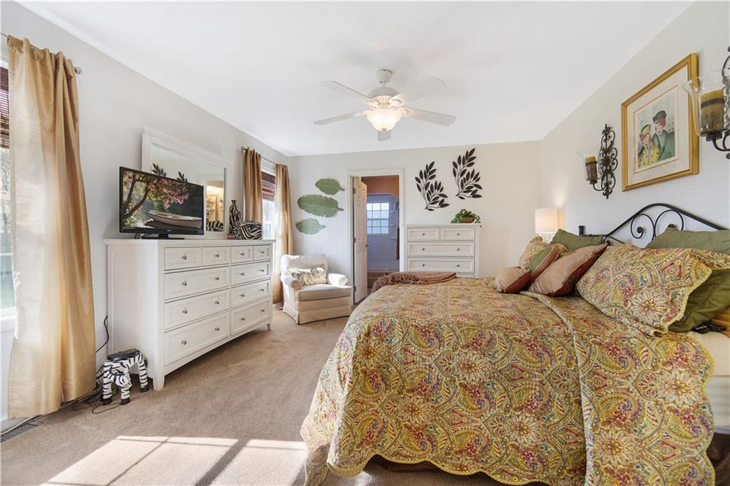 195 Elm Road Avella, PA 15312 - Photo 12 of 25 The 14x11 MASTER BEDROOM is naturally light and bright. It features an overhead ceiling fan with light, natural toned carpet and plenty of space.