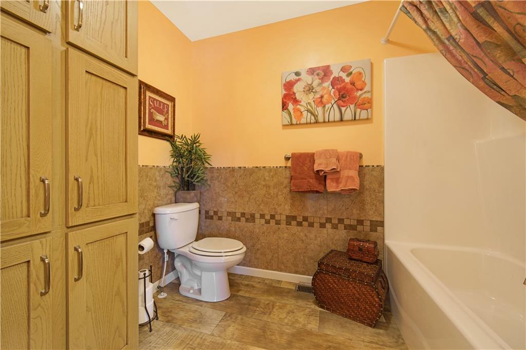 195 Elm Road Avella, PA 15312 - Photo 18 of 25 Another view of the MAIN BATHROOM featuring attractive congoleum laminate and tile. Lots of storage space for all your bathroom needs.