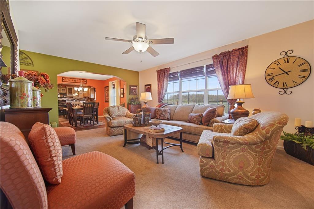 195 Elm Road Avella, PA 15312 - Photo 6 of 25 Enter the LIVING ROOM with praise. The natural color of the carpet is offset by the bold color scheme on the walls. The overhead ceiling fan with light couples with the large picture window to provide plenty of light.