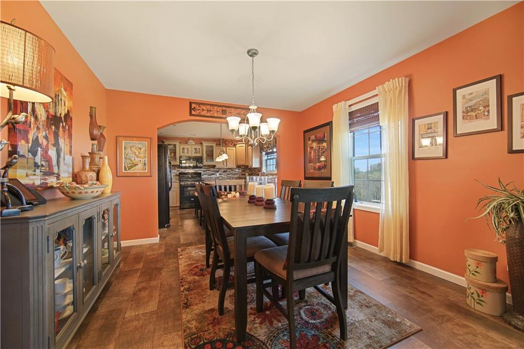 195 Elm Road Avella, PA 15312 - Photo 8 of 25 The DINING ROOM offers plenty of space for everyone. The overhead ceiling fan with light, made of chrome and frosted glass, give way to the beautiful, tough congoleum flooring. Its wood plank appearance adds luster to the room. The large picture window provides plenty of natural light in the room. Boldly painted in vibrant colors. Wow! It really pops!