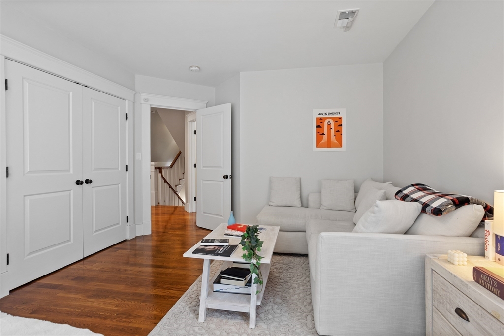 5 Walnut Street Lexington, MA 02421 - Photo 10 of 34 a living room with furniture and wooden floor
