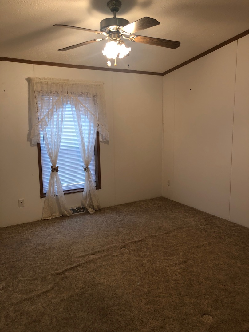 1043 Brewster Road Amboy, IL 61310 - Photo 9 of 17 a view of an empty room with a window