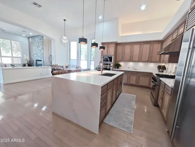 a view of a livingroom with furniture and wooden floor