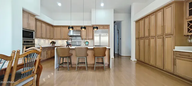 a view of a livingroom with furniture and a window