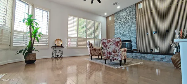 a view of a room with a large window and chandelier