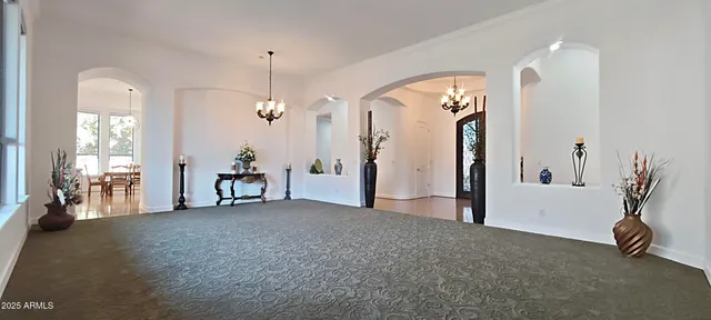 a large white bed in a white room