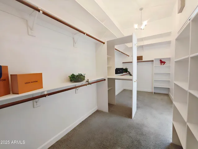 a living room with furniture and a ceiling fan