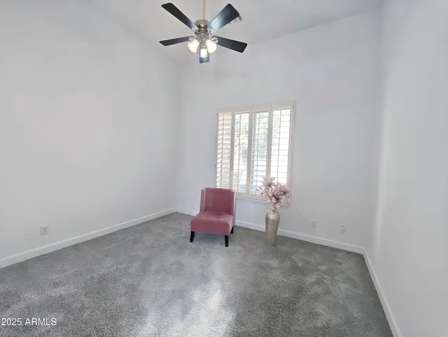 a view of a roof deck with couches and potted plants