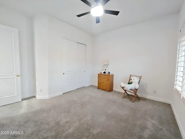 a view of a backyard with sitting area