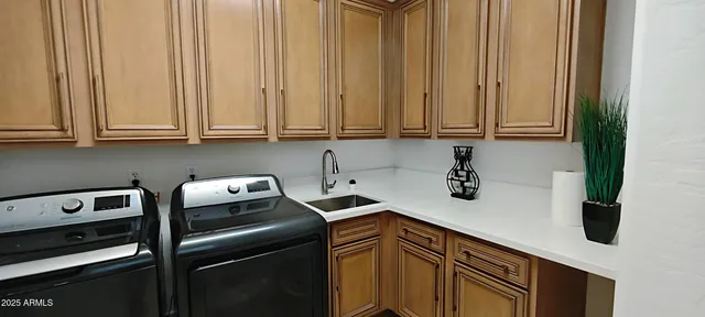 an aerial view of a house with a yard and furniture