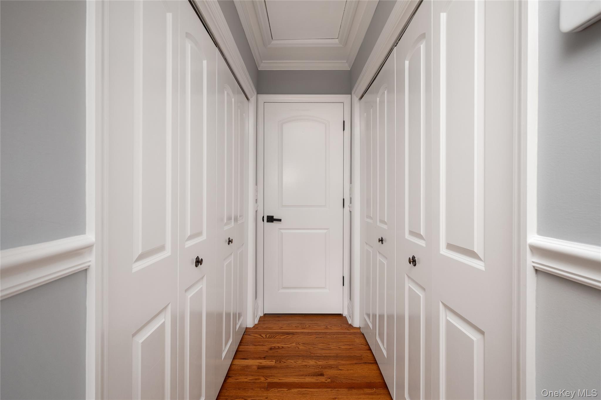 148 Exeter Road Massapequa, NY 11758 - Photo 15 of 28 a view of a hallway with wooden floor and entryway