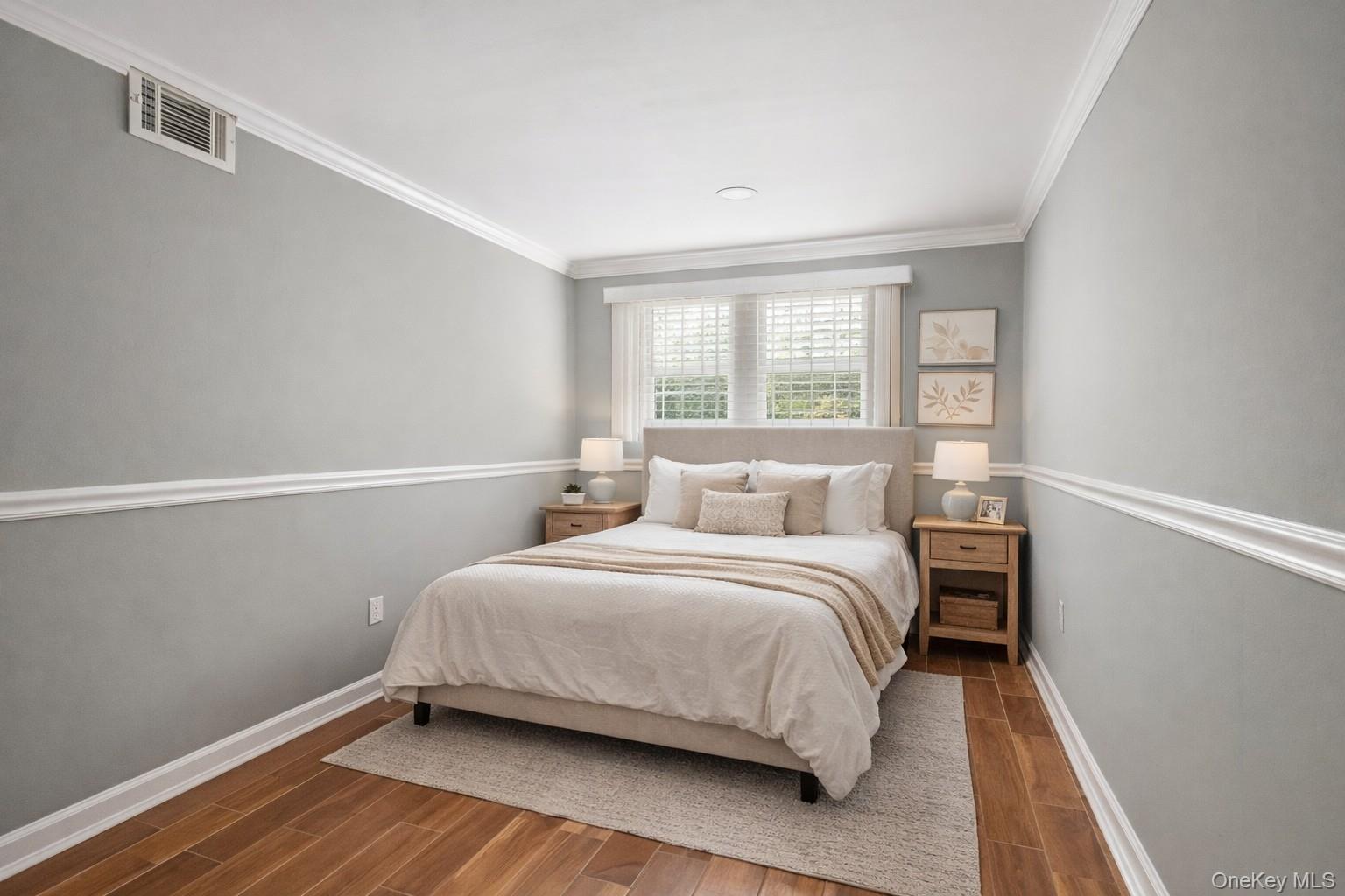 148 Exeter Road Massapequa, NY 11758 - Photo 21 of 28 a bedroom with a bed and wooden floor