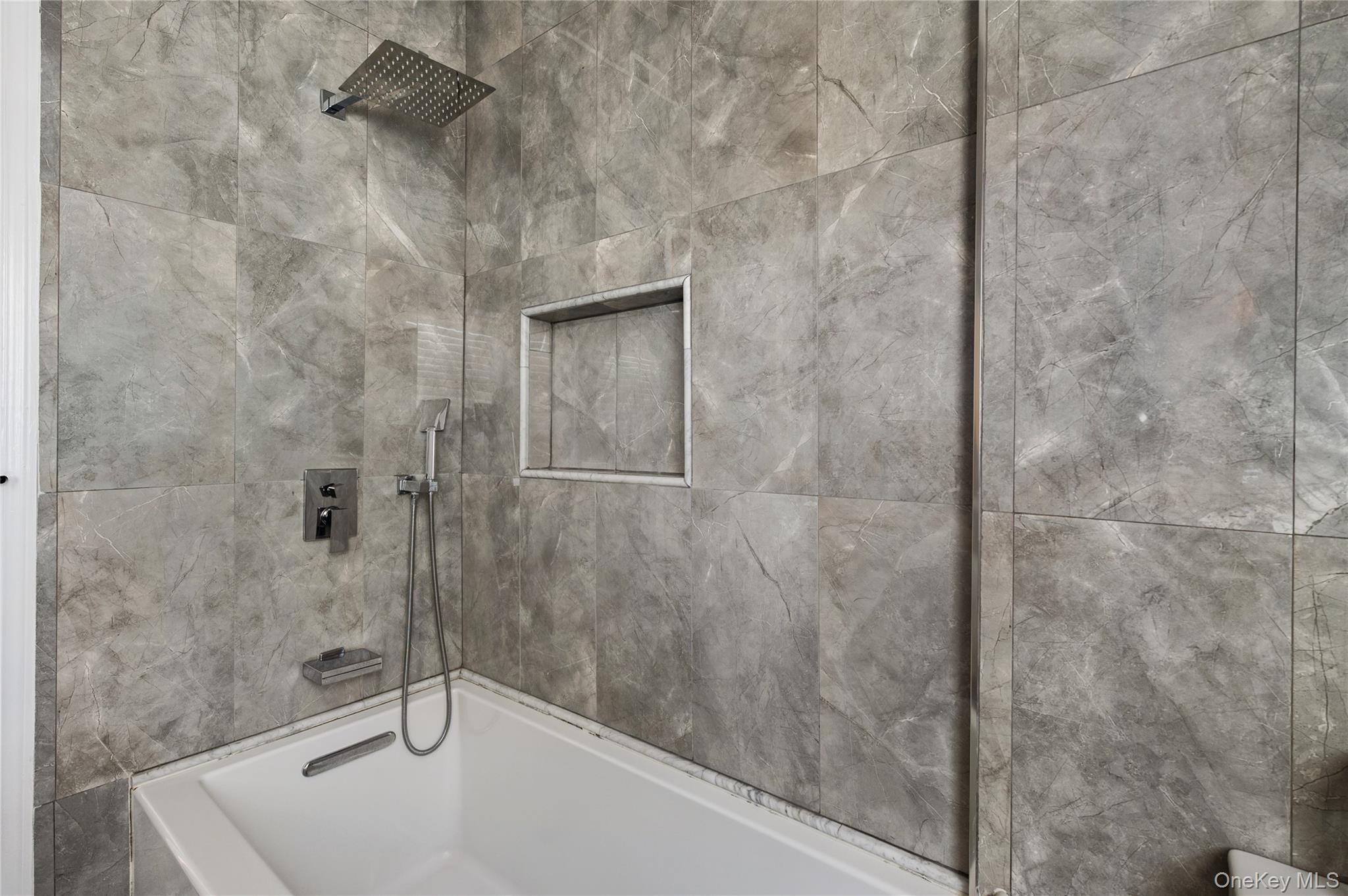 148 Exeter Road Massapequa, NY 11758 - Photo 23 of 28 a bathroom with a sink and a shower