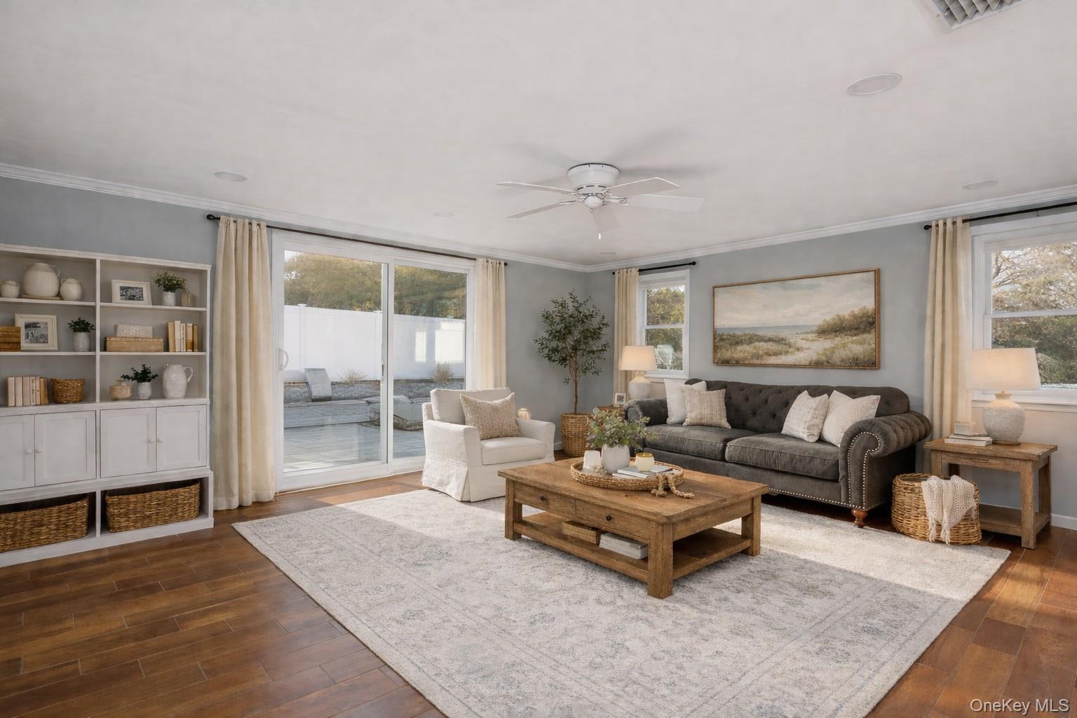 148 Exeter Road Massapequa, NY 11758 - Photo 24 of 28 a living room with furniture and a large window