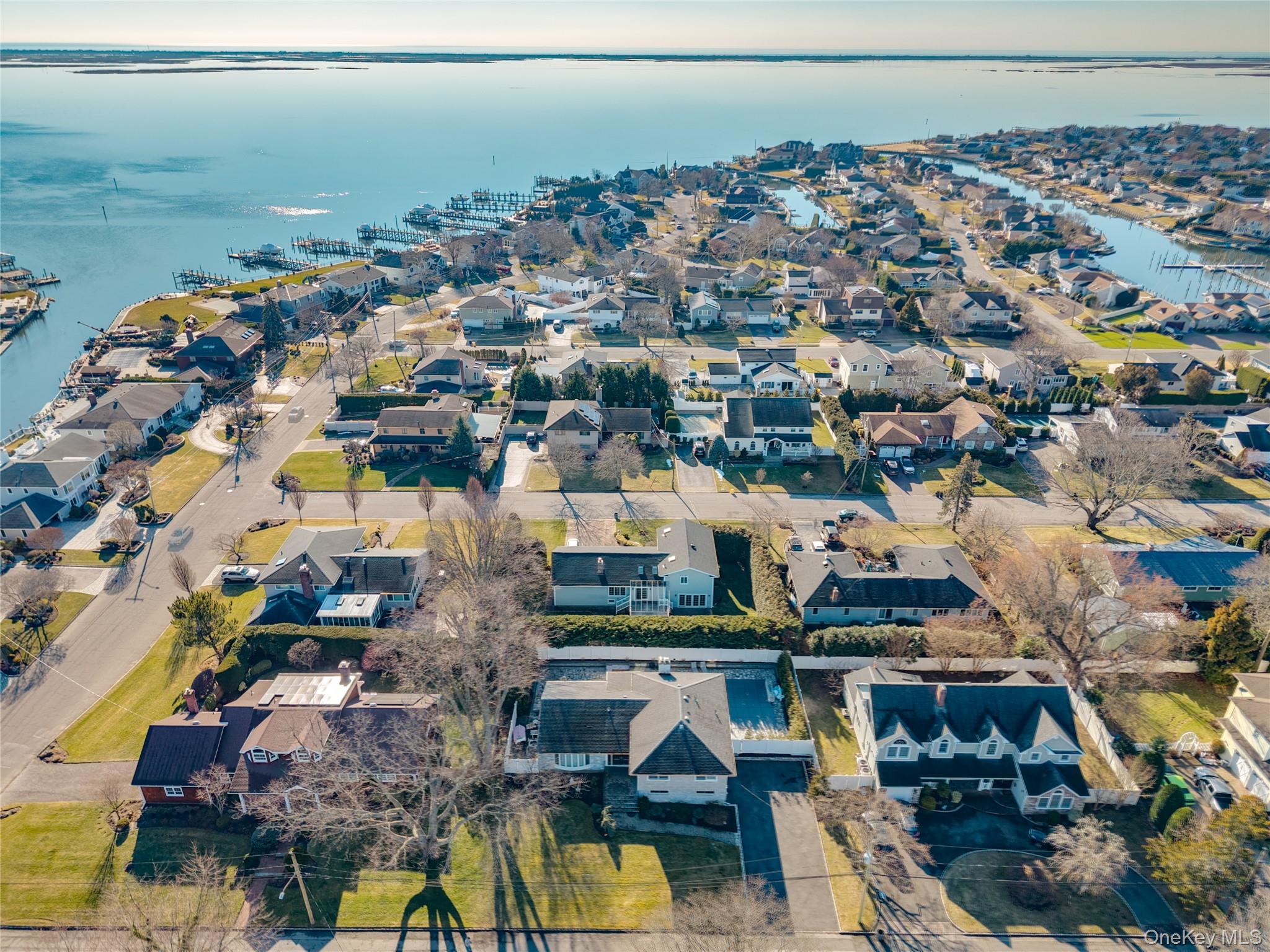 148 Exeter Road Massapequa, NY 11758 - Photo 4 of 28 an aerial view of residential houses with outdoor space