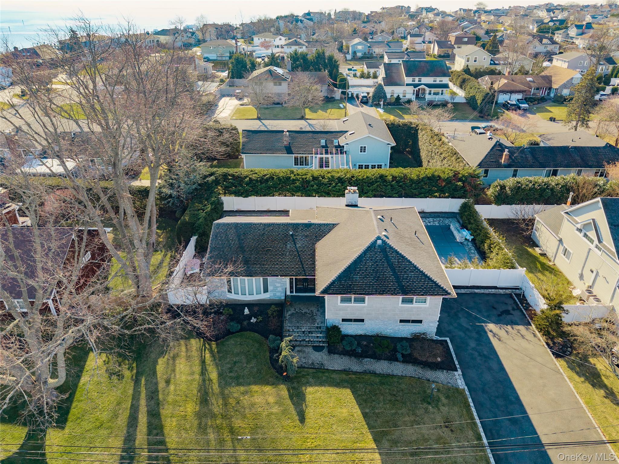 148 Exeter Road Massapequa, NY 11758 - Photo 5 of 28 an aerial view of residential houses with outdoor space