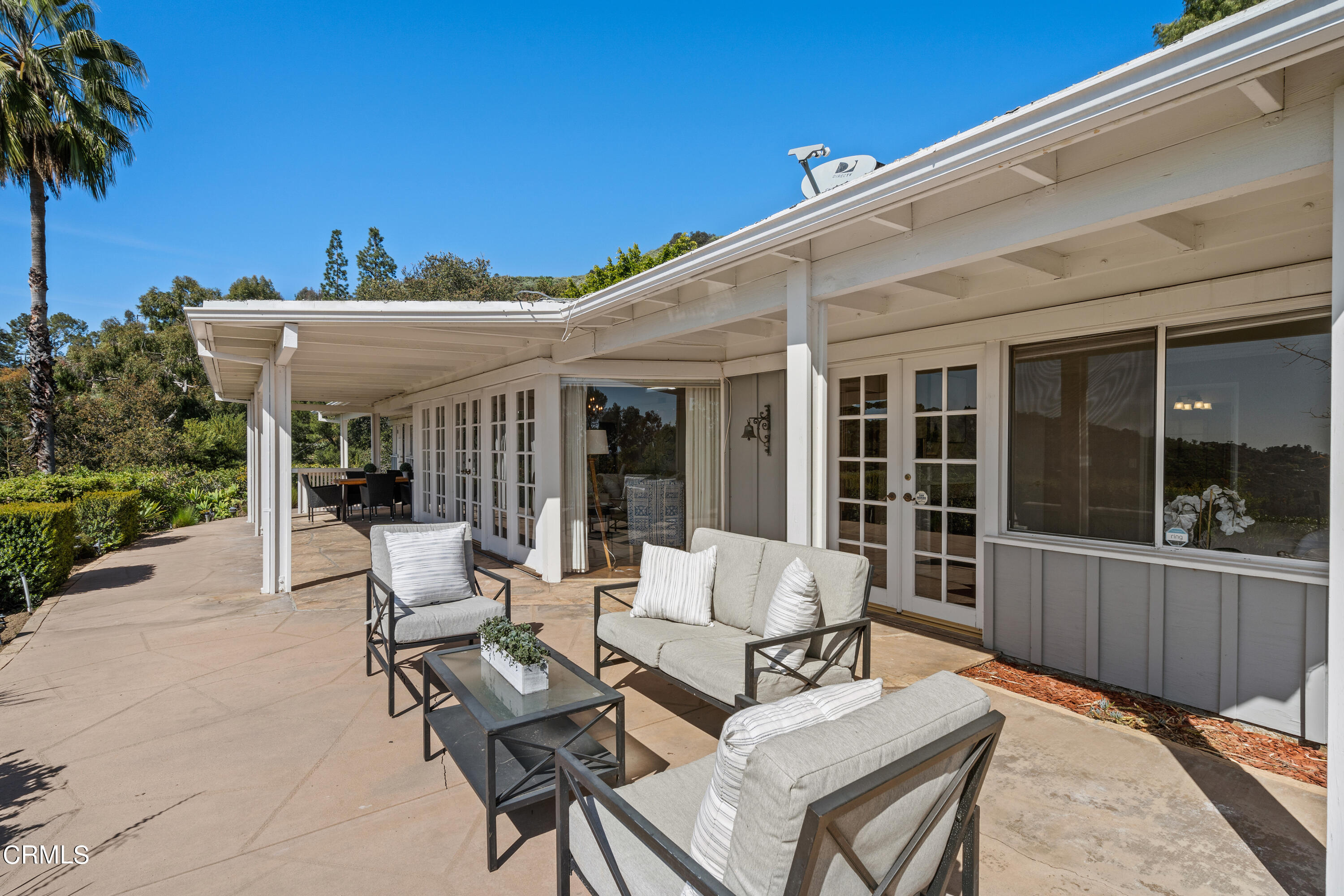 1444 Normandy Drive Pasadena, CA 91103 - Photo 21 of 25 a view of a patio with couches table and chairs and potted plants