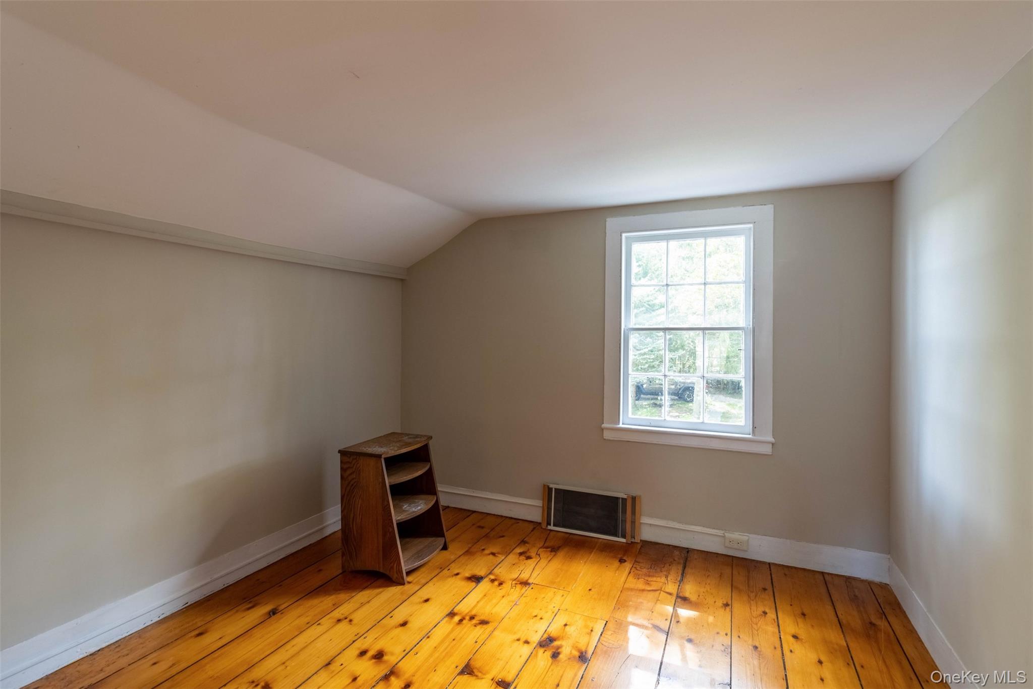 19450 Main Road Mattituck, NY 11952 - Photo 12 of 16 Bonus room featuring light wood finished floors and lofted ceiling