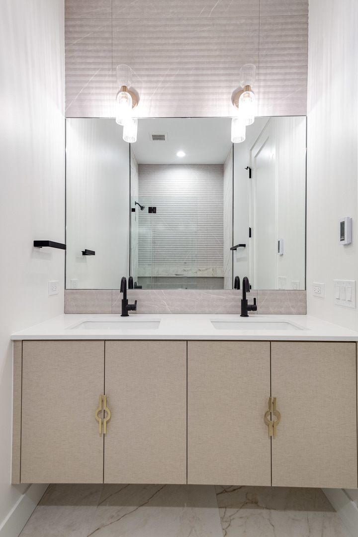 1334 West Rosedale Avenue, Unit 3 Chicago, IL 60660 - Photo 13 of 24 a bathroom with a sink and a mirror