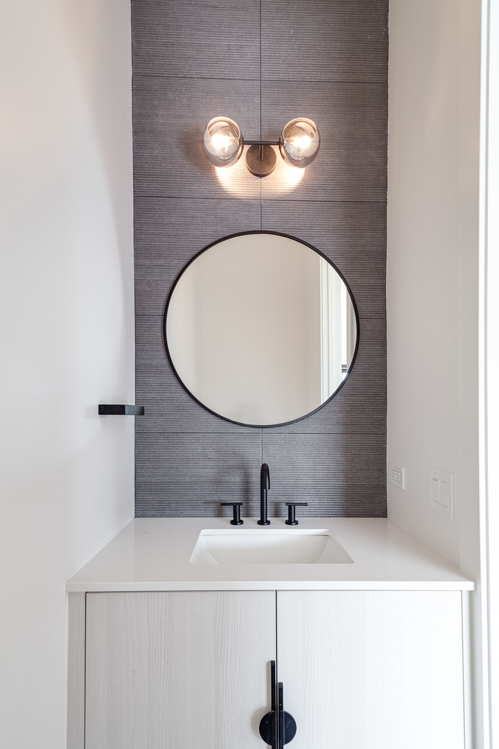 1334 West Rosedale Avenue, Unit 3 Chicago, IL 60660 - Photo 14 of 24 a bathroom with a sink and a mirror
