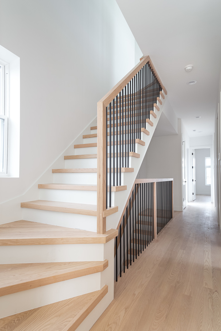 1334 West Rosedale Avenue, Unit 3 Chicago, IL 60660 - Photo 15 of 24 a view of staircase with railing and a rug