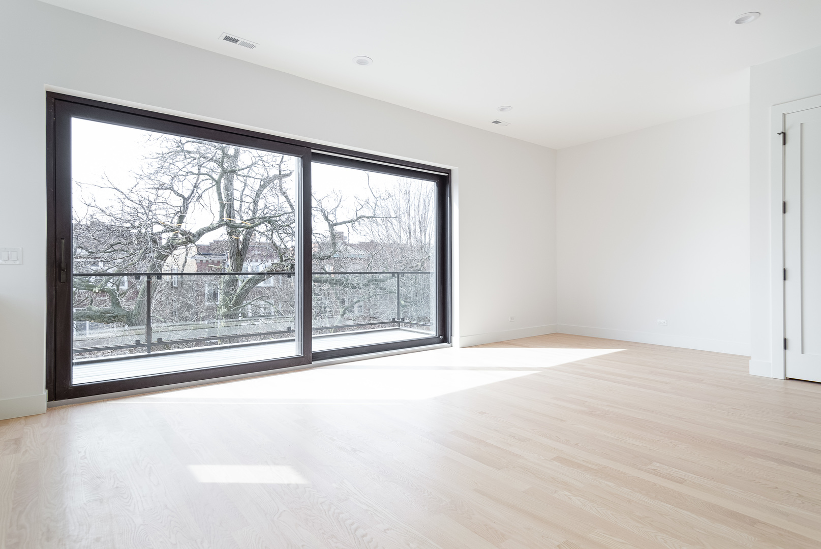 1334 West Rosedale Avenue, Unit 3 Chicago, IL 60660 - Photo 9 of 24 a view of an empty room with a window