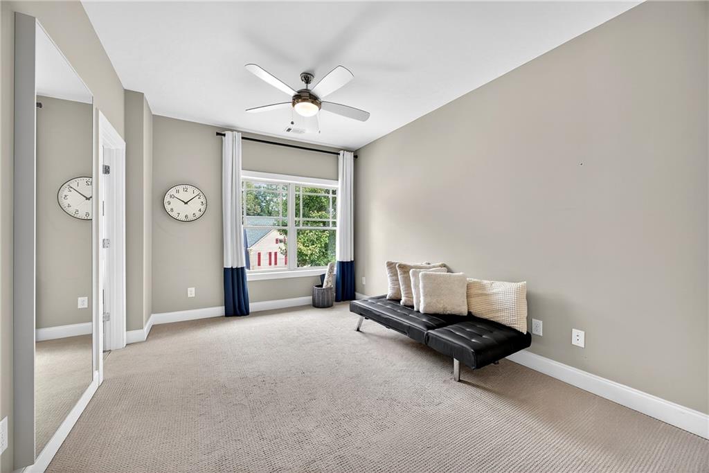 2675 Sugar Mill Drive Southeast Atlanta, GA 30316 - Photo 20 of 38 an empty room with windows and fan