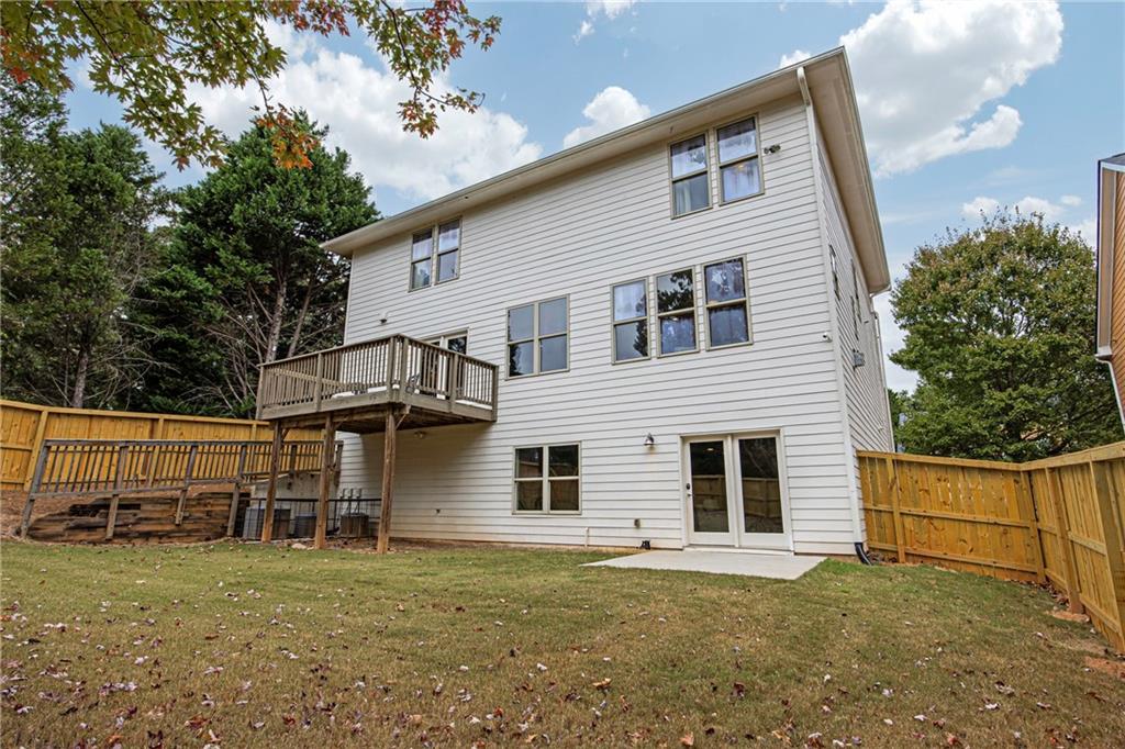 2675 Sugar Mill Drive Southeast Atlanta, GA 30316 - Photo 32 of 38 a front view of a house with a yard
