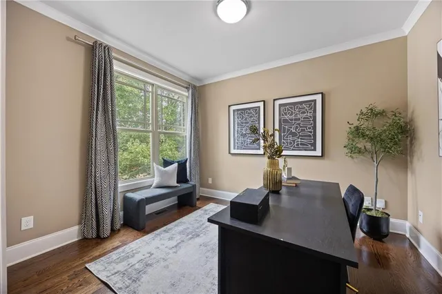a view of a livingroom with a table and workspace
