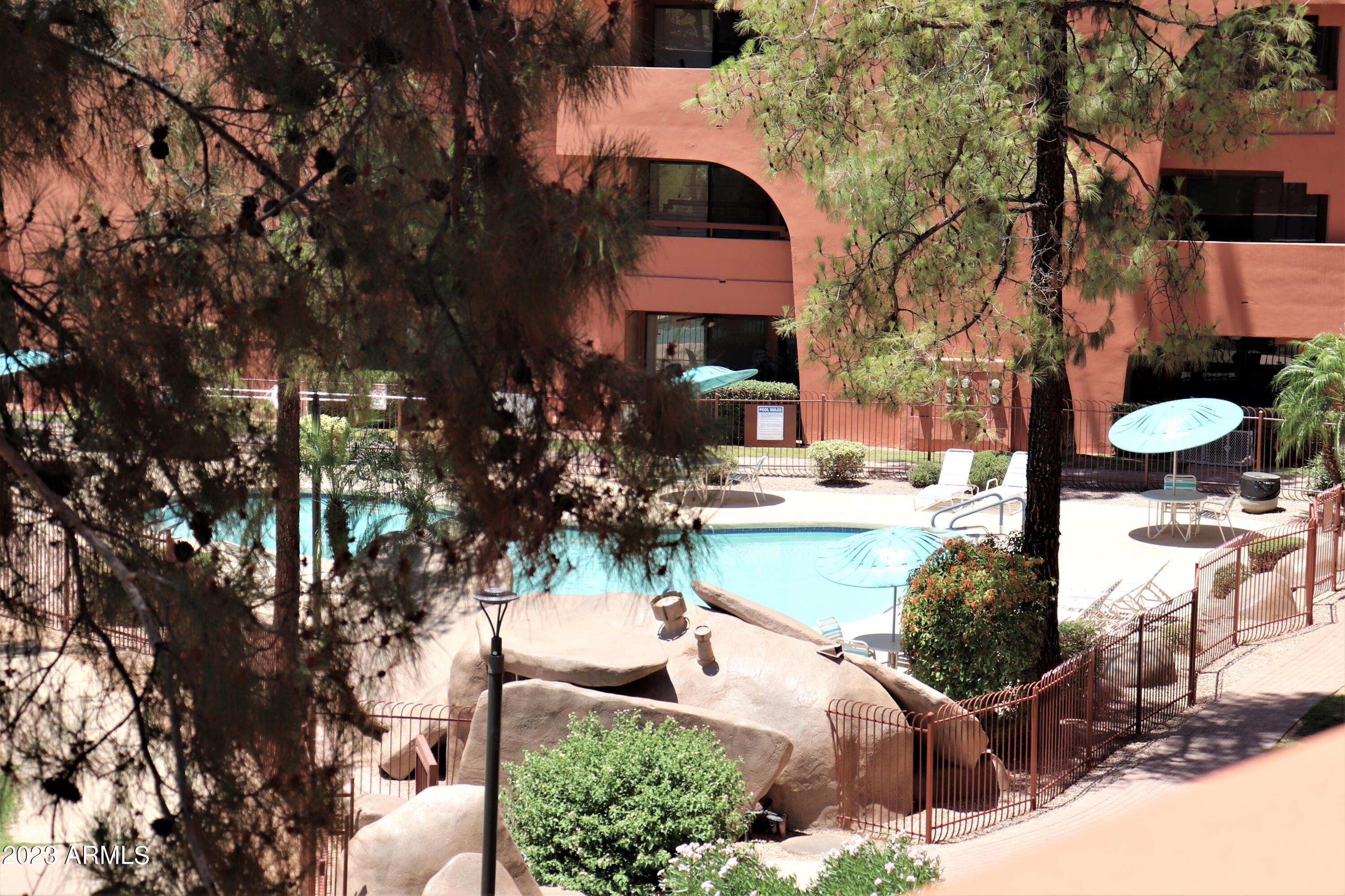 4303 East Cactus Road, Unit 433 Phoenix, AZ 85032 - Photo 25 of 54 Balcony View of Pool Four