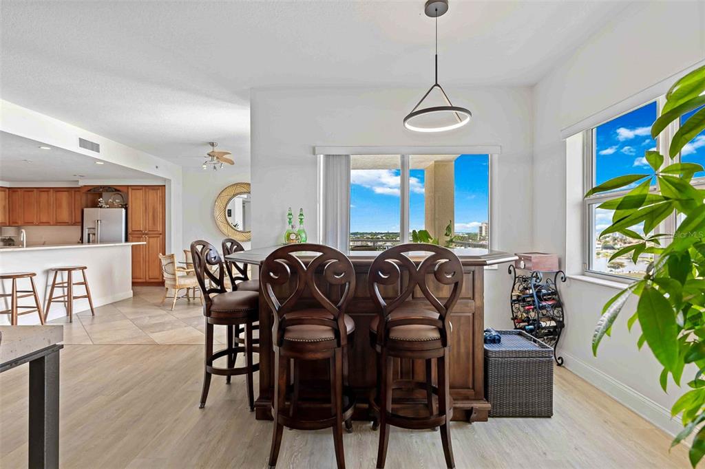 606 Riviera Dunes Way, Unit 601 Palmetto, FL 34221 - Photo 20 of 70 a view of a dining room with furniture window and wooden floor
