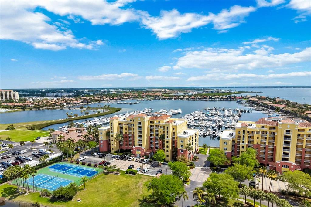 606 Riviera Dunes Way, Unit 601 Palmetto, FL 34221 - Photo 2 of 70 a view of a city and lake