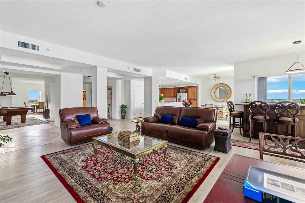 606 Riviera Dunes Way, Unit 601 Palmetto, FL 34221 - Photo 21 of 70 a living room with furniture and wooden floor