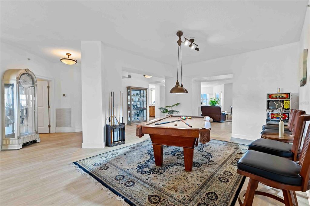 606 Riviera Dunes Way, Unit 601 Palmetto, FL 34221 - Photo 23 of 70 a living room with furniture and a wooden floor